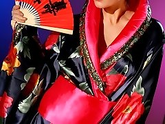 Geisha teases her way out of the kimono revealing gorgeous lingerie.