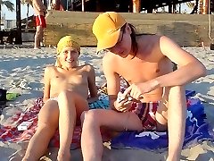 Naughty teen shows off her privates on the sand