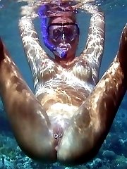 Nudist lovers caught by spy camera having sex fun in water