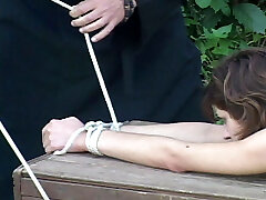 Naked super-cute tied to a bench and caned without mercy on her blistered and bruised bare bottom