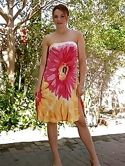 Uber-cute coed Ava rubs her pussy outdoors.