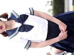 Sexy Asian doll in a schoolgirl garb loves to tease the 