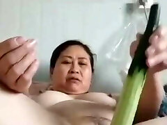 mature chubby Japanese woman with veggie