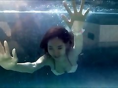 Youthfull Chinese Girl in Sexy Bikini at a Swimming Pool