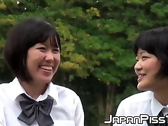 Cute Japanse college girl with pigtails pisses in the wind