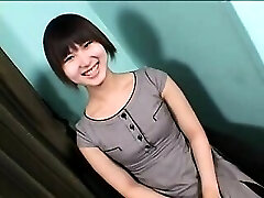 Enticing Asian t-model with a cute smile sensually drops he