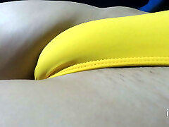 I permitted to my b to take off my shorts to record my engorged pussy in a tight yellow bathing suit.