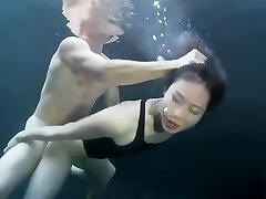 swimsuit girl sex with a boy underwater