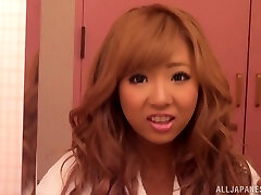 Gorgeous redhead Asian with biug baps in thong gets pussy waxed