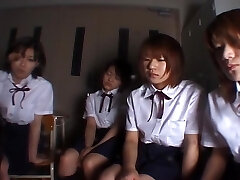 Four Japanese school chicks slobbering on teacher
