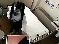 Cute Asian schoolgirl with pigtails has a doctor fingering 