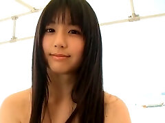 Svelte Japanese hotty runs around the beach in tiny yellow bathing suit