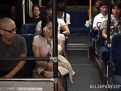 Two Guys Fucking a Buxomy Japanese Girl's Meaty Boobs in the Public Bus