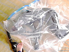 Cute Latex lady on vacuum bag and mask, breathplay