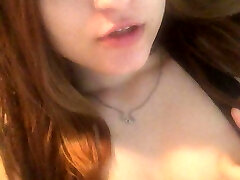 Redhead Asian wanks her cunt with fingers and cums