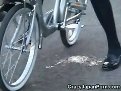 Schoolgirl Pumps Out on a Bike in Public! 