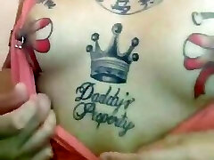Filipina slut showing off her pierced and tattoo nipples