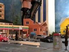 sexy giantess stomping city in high heels and boots