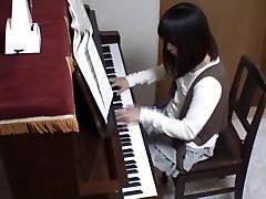 Piano teacher rear bangs his pupil throughout the piano keys