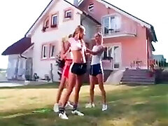 Girls in Adidas shine shorts and sports boots