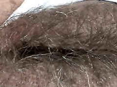 While I rest at the motel on the beach, my boss films my big hairy pussy