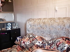 Housewife getting into Her undergarments for Her Hubby coming home