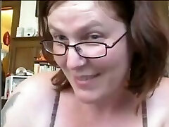 Short haired mature nerdy bitch flashes her gross tits and huge ass