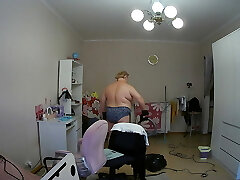mother-in-law cleans the room naked