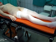 The examination of a mature girl in doctor's office