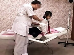 Pigtailed Japanese girl with perky tits gets massaged and f