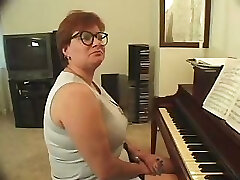 Plump piano teacher busted getting skewered with two dicks