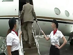 Luxurious stewardess is fucking with two businessmen on the board of a plane