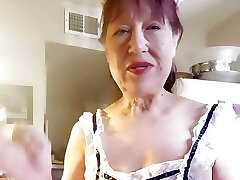 Granny in my fantastic lace apron cooking shrimp & grits