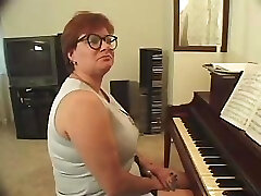 Plump piano teacher busted getting skewered with two dicks Plump piano teacher busted getting skewered with two dicks