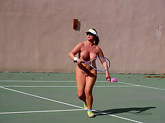 Nude playing tennis