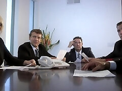 Busty sandy-haired secretary slut deep-throats dicks in office orgy