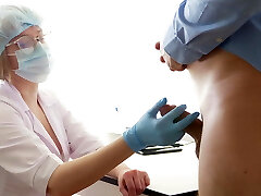 Huge-boobed Doctor milking the prostate. Stuck her finger up the ass