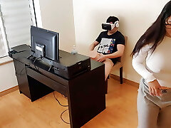 Super-fucking-hot stepmother masturbates next to her stepson while he watches porn with virtual reality glasses