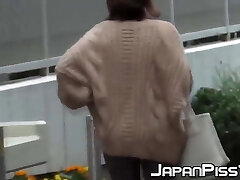 Naughty Asian cuties pissing in the streets