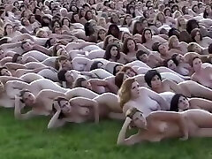 5000 bare people laying out for the cameraman who makes books