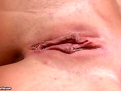 Short haired towheaded White Angel stretches her twat