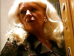 Aged and busty German granny in stockings enjoys making a prick cum