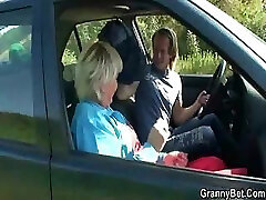Granny is picked up from the road and drilled in the car