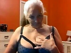 Grandma 68 years shows big tits and cunt