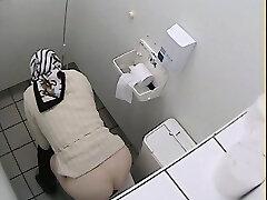 Granny got her ass on rest room voyeur video while pissing