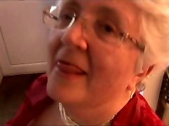 Granny with massive boobies unclothing and spreading