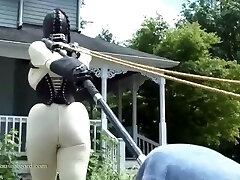 rubber doll jewell in TIGHT harness and white catsuit