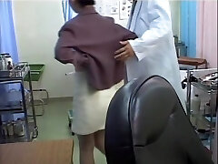 Kinky therapist dildo penetrates Asian in the medical office