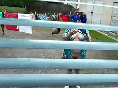 Bare in public. Neighbor saw knocked up neighbor in window who was drying clothes in yard sans bra and panties. Nudist