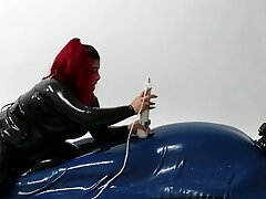 Mistress wearing Latex torturing trapped Victim in Rubber Vacuum Bed VacBed